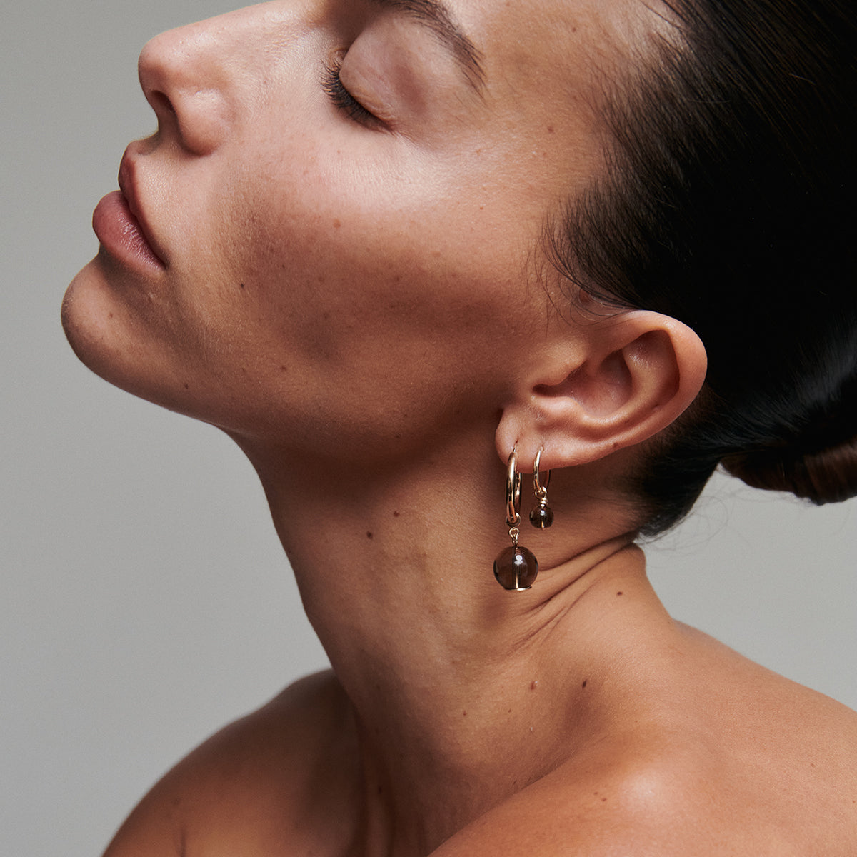 [text overlay: Model wears Bold Quartz Hoop (left) and Tiny Quartz Hoop (right)] 