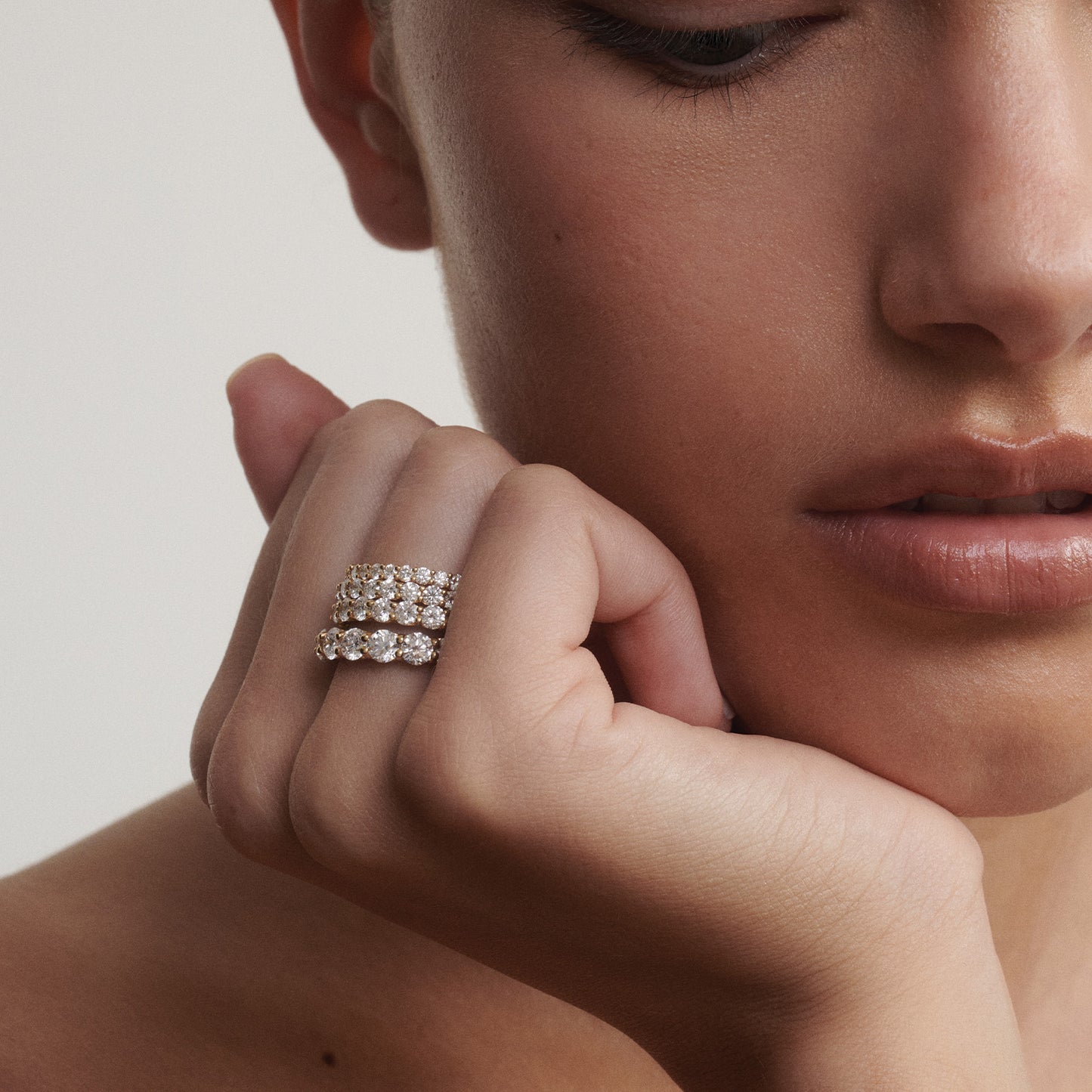 Close-up of a woman's hand wearing four diamond rings stacked on a neutral background

[text overlay: From top to bottom; 2mm, 2.5mm, 3mm and 4mm]