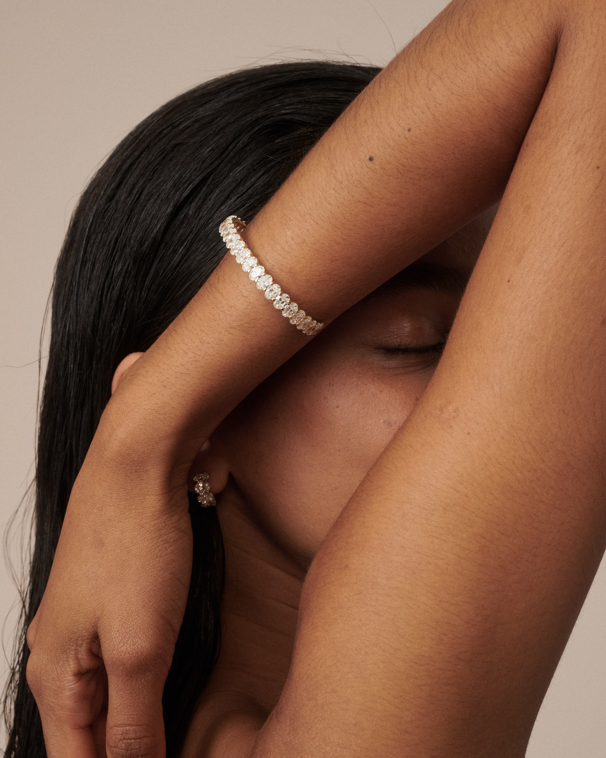 Lab-grown diamond bracelet with oval row of small stones on wrist