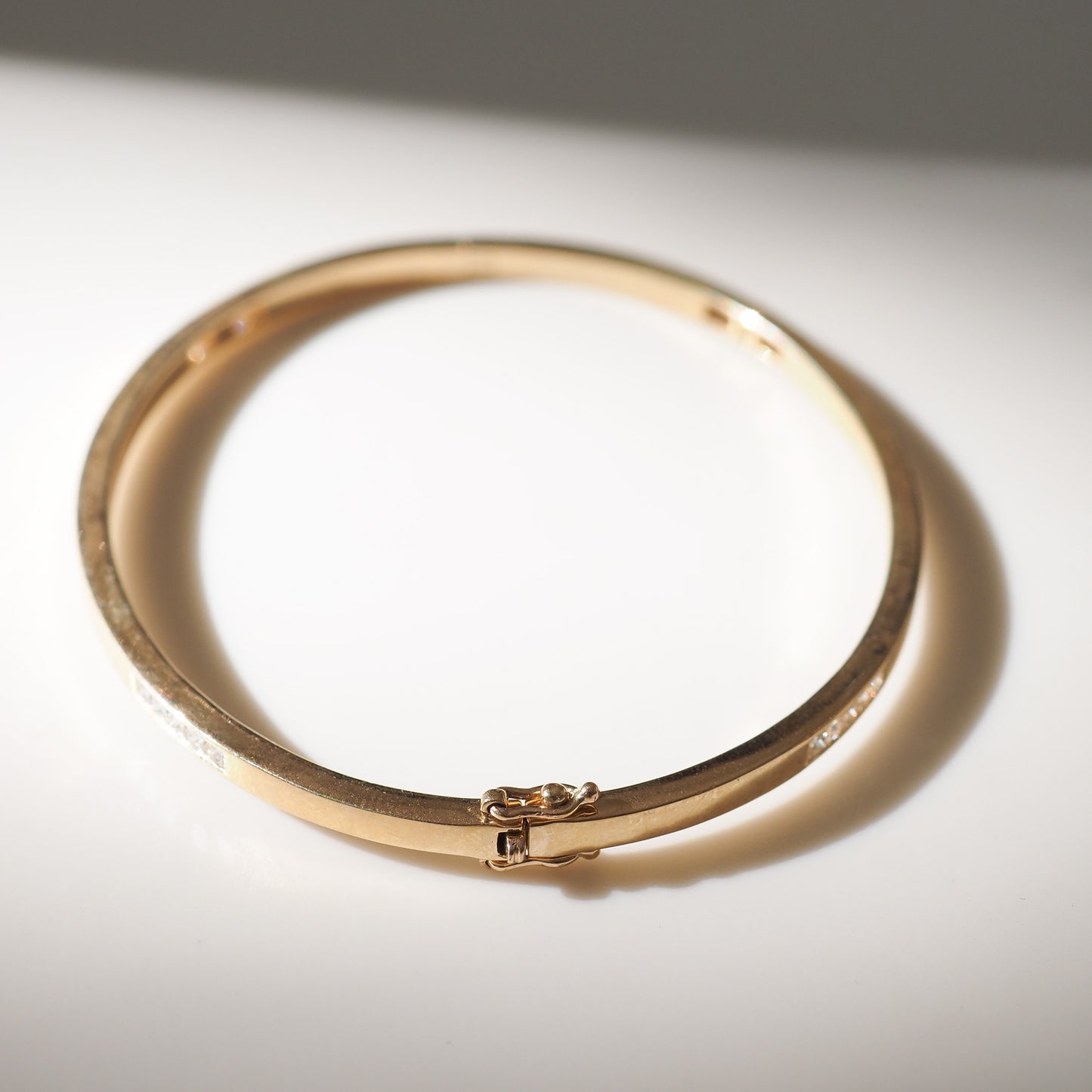Gold bracelet on a white background