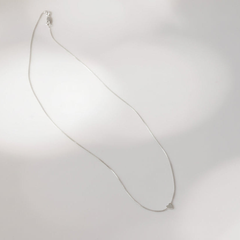 Heart charm on silver chain